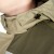 Hood fastening flaps can be stored in special pockets on the collar when not in use